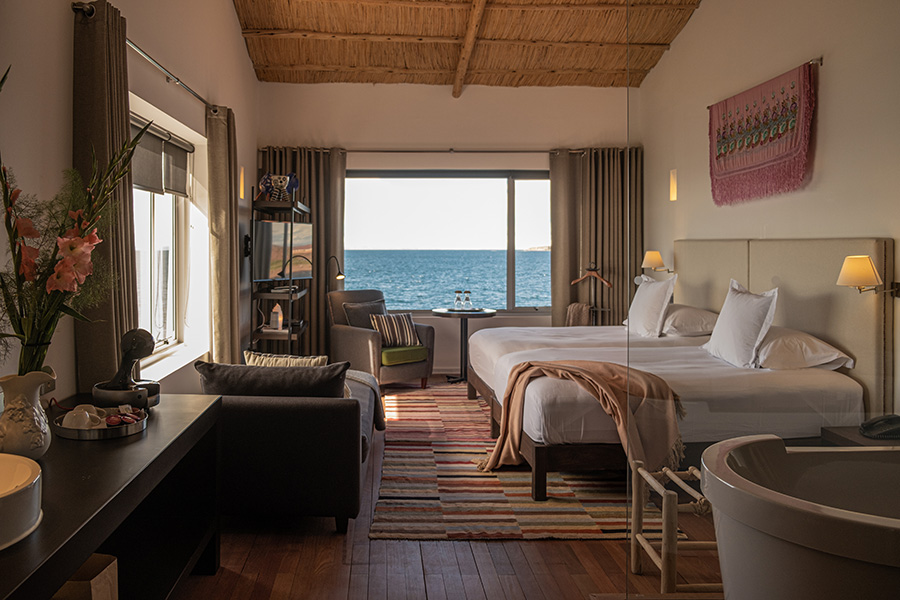 Relax with unique panoramic lake views from the comfort of your room at Titilaka Lodge | Photo credit: Titilaka Lodge