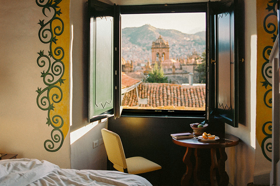 Decompress and admire the view from your elegant suite at Belmond Hotel Monasterio | Photo credit: Belmond
