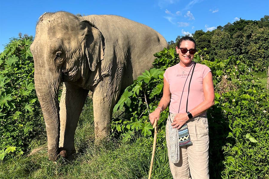Tracey with a rescued elephant in Laos | Travel Nation