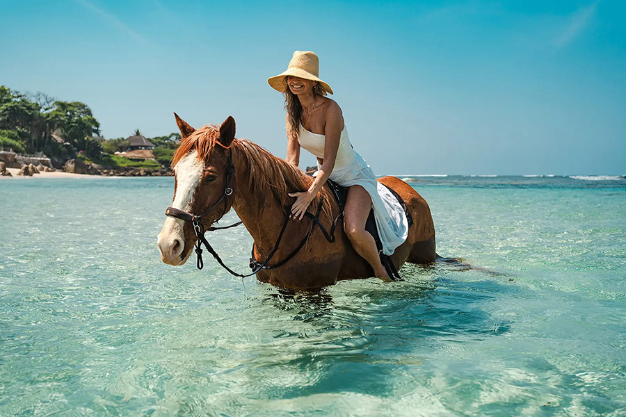 Swim with horses on Nihiwatu Beach at Nihi Sumba | Photo credit: Nihi Sumba