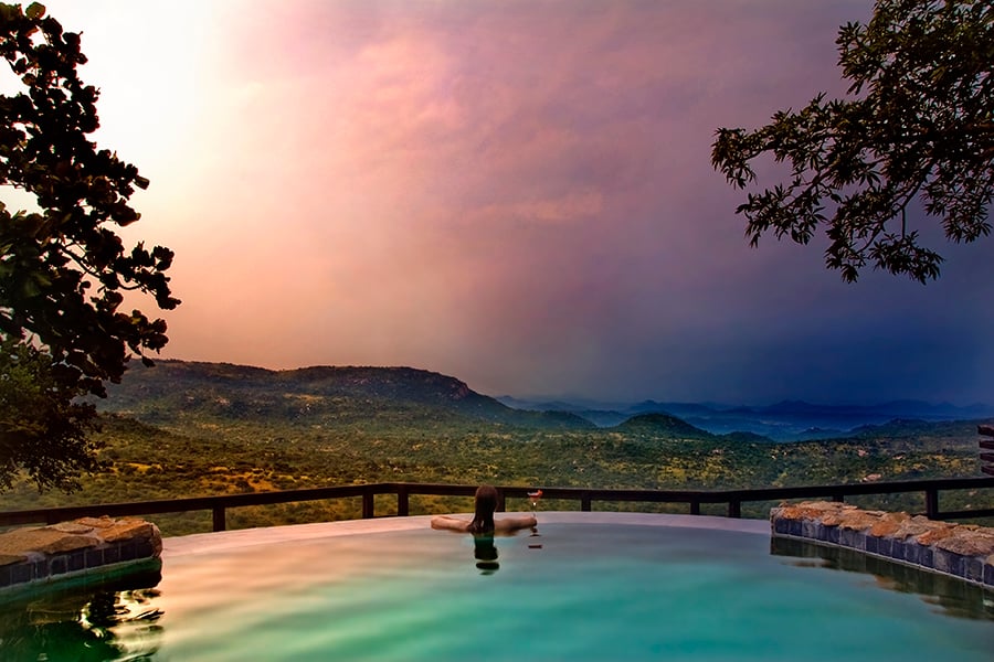 Relax by the pool with views over the Malelane Mountains