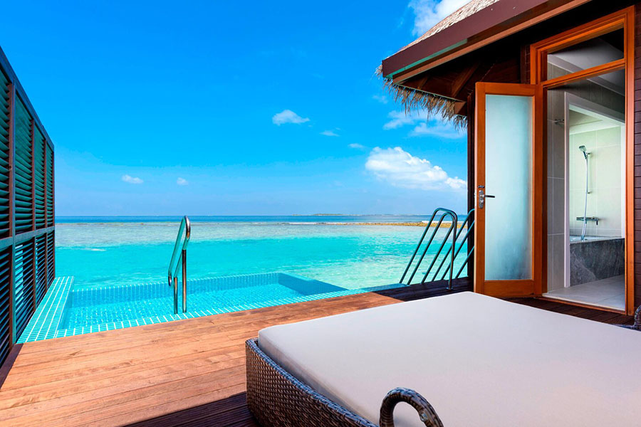 Swim in your own private pool in an overwater bungalow in the Maldives | Photo credit: Sheraton Full Moon Resort & Spa 