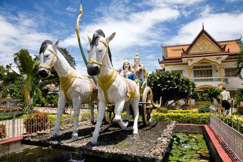 Wander amongst the colourful statues and French colonial buildings of Battambang