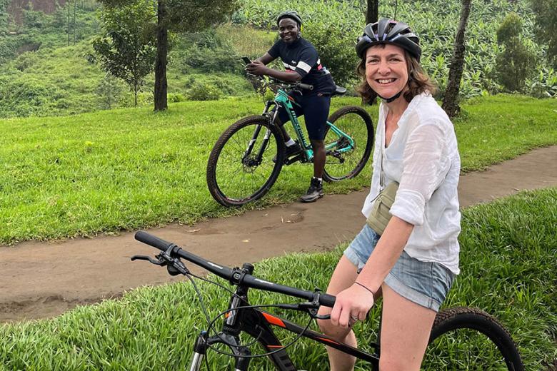 Liz cycling at Lake Kivu | Travel Nation