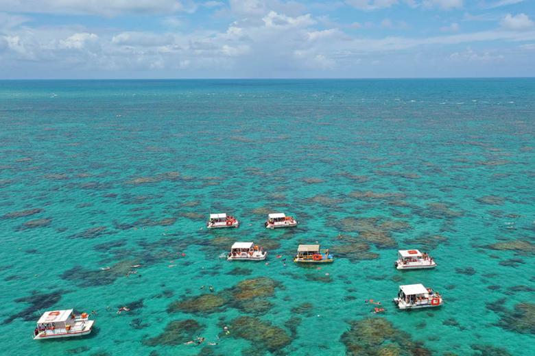 Boats over the Maracajau coral reefs in Natal, Brazil | Travel Nation
