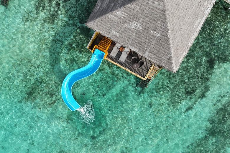 Stay in a Lagoon Suite with a slide at Cocoon Maldives | Photo credit: Cocoon Maldives