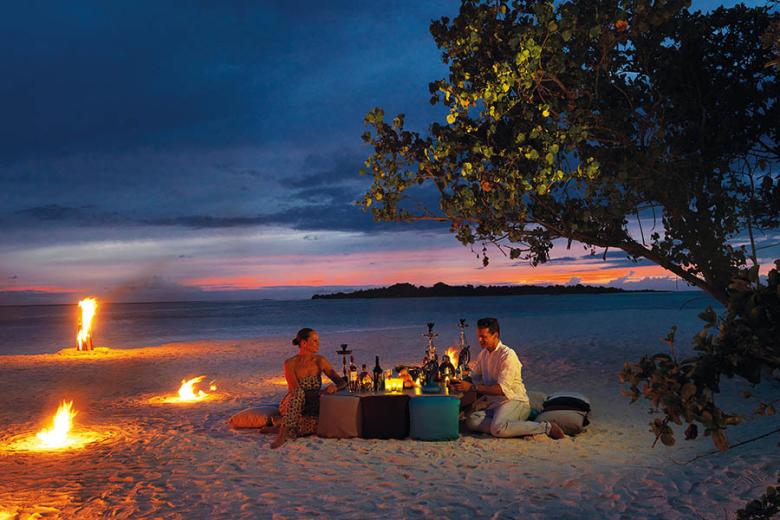 Book a private beach dinner at You & Me Maldives | Photo credit: Cocoon Collection