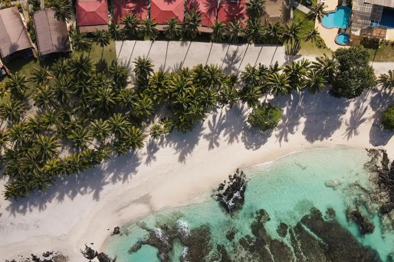 Swim in the pool on the beach at the Return to Paradise Resort | Photo credit: Return to Paradise Resort