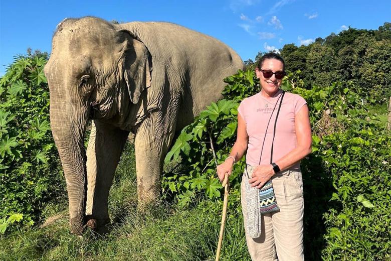 Tracey with a rescued elephant in Laos | Travel Nation