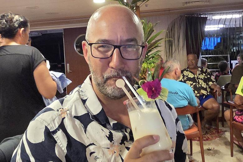 Jim with a cocktail aboard the Aranui | Travel Nation