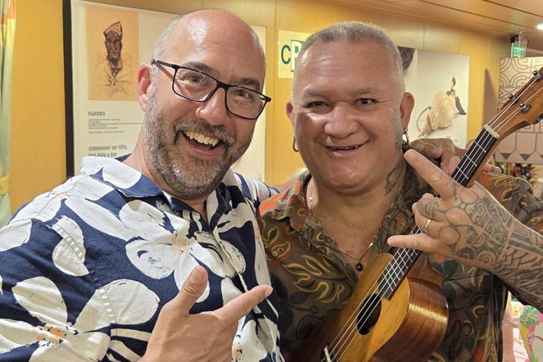 Jim with his ukulele teacher on the Aranui 5 | Travel Nation