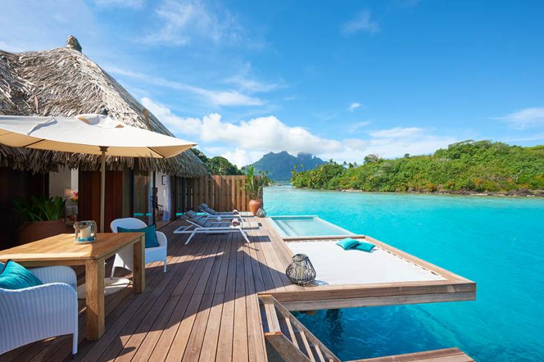 Relax on your own private deck in Bora Bora | Photo credit: Conrad Hotels and Hilton Hotels
