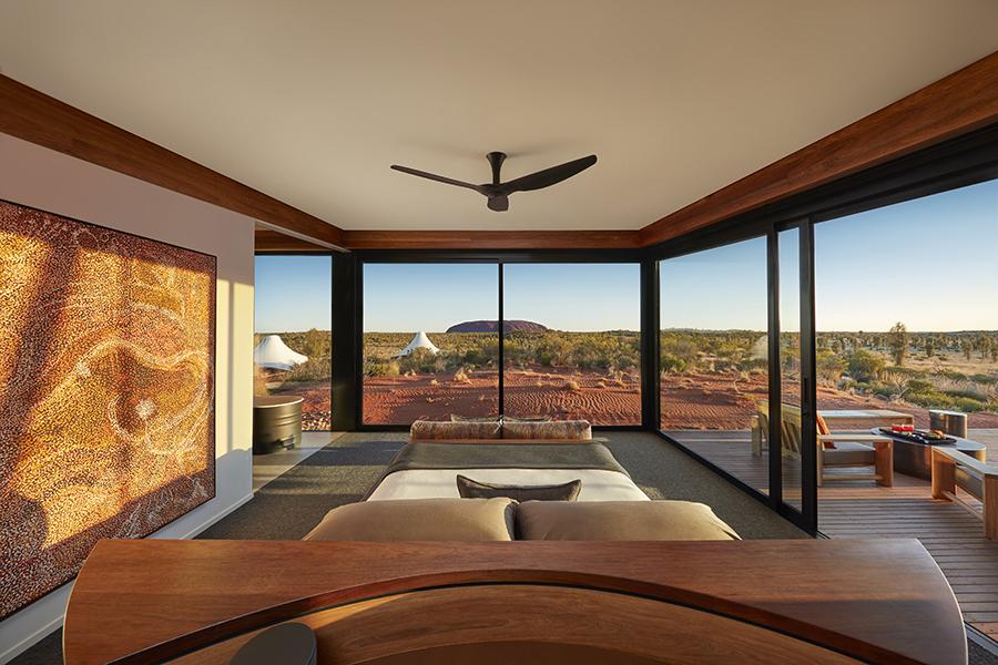 Relax in the pavilion bedroom with sweeping desert views and Uluru on the horizon at Longitude 131° | Photo credit: George Apostolidis