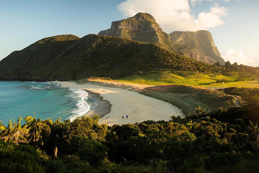 Take a Tranquil Stroll Along the Beach with Mountain Views at Capella Lodge | Photo credit: Capella Lodge