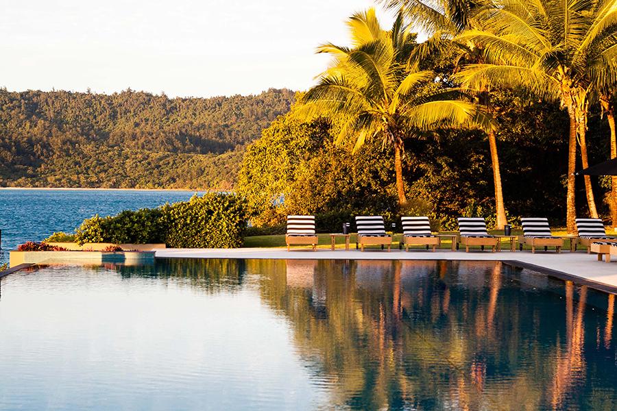 Lounge by the water and feel the sun’s warmth at Qualia | Photo credit: Qualia