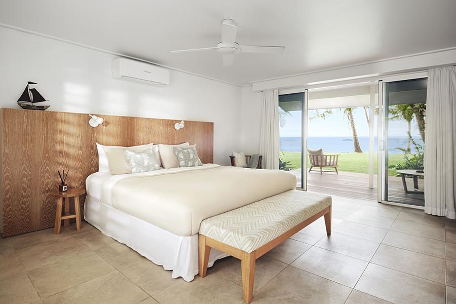 Enjoy serene sea views from the comfort of your suite bedroom at Orpheus Island Lodge | Photo credit: Orpheus Island Lodge
