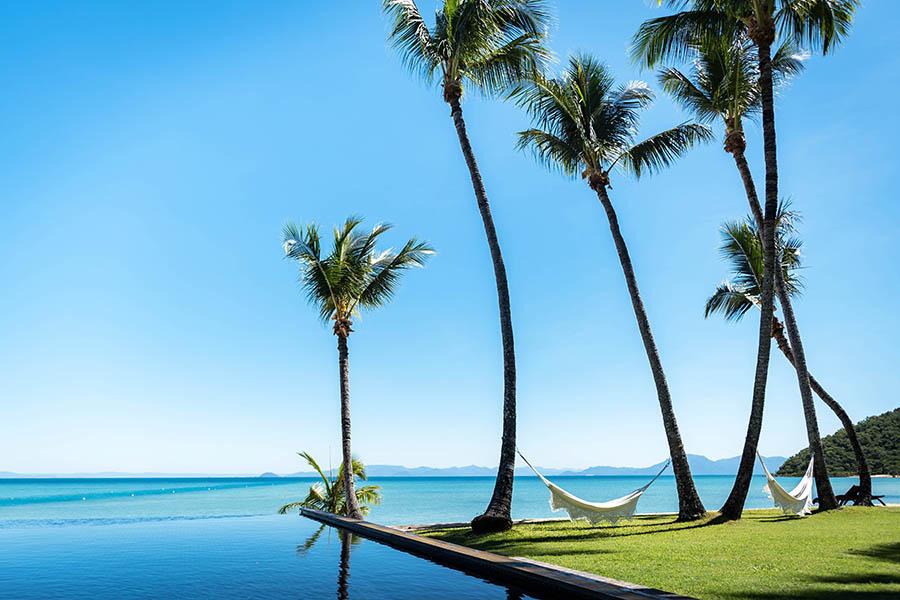 Sway gently in the hammock by the sea at Orpheus Island Lodge | Photo credit: Orpheus Island Lodge