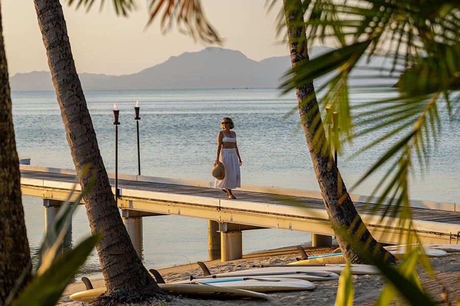 Watch the sunset glow over the jetty’s peaceful waters at Orpheus Island Lodge | Photo credit: James Vodicka