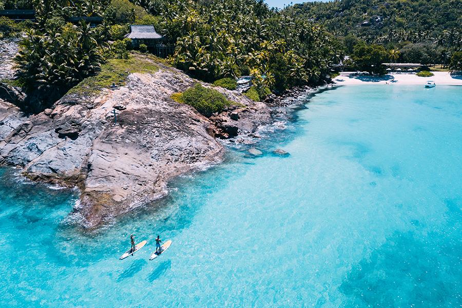 Go stand up paddleboarding in the pristine water around North Island in the Seychelles | Photo credit: North Island