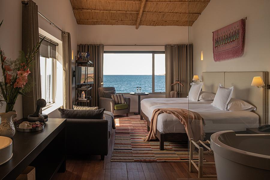 Relax with unique panoramic lake views from the comfort of your room at Titilaka Lodge | Photo credit: Titilaka Lodge