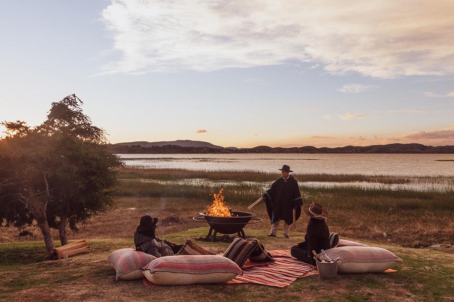 Watch the sunset with a cosy lakeside picnic at Titilaka Lodge in Peru | Photo credit: Titilaka Lodge