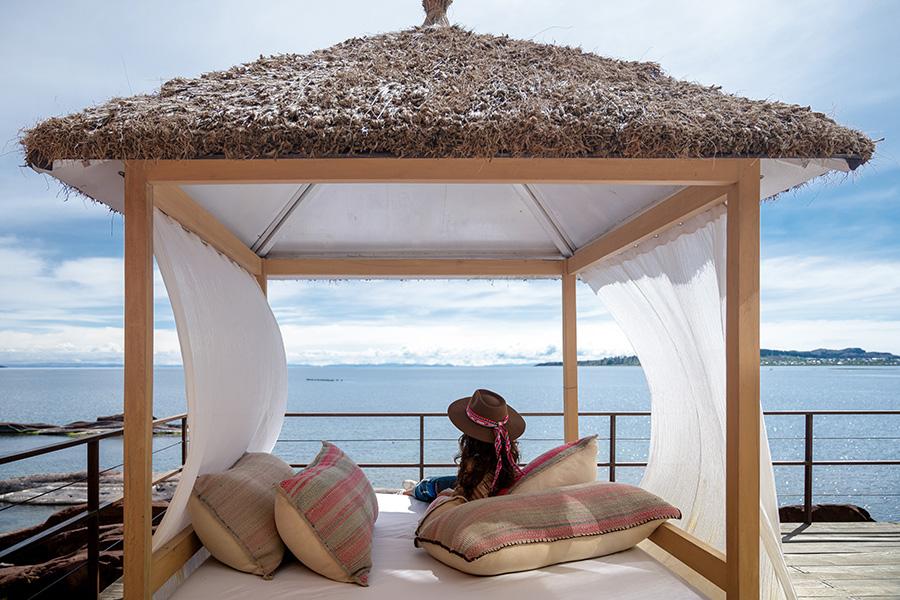 Recharge on a luxury sun bed on the deck at Titilaka Lodge in Peru | Photo credit: Titilaka Lodge