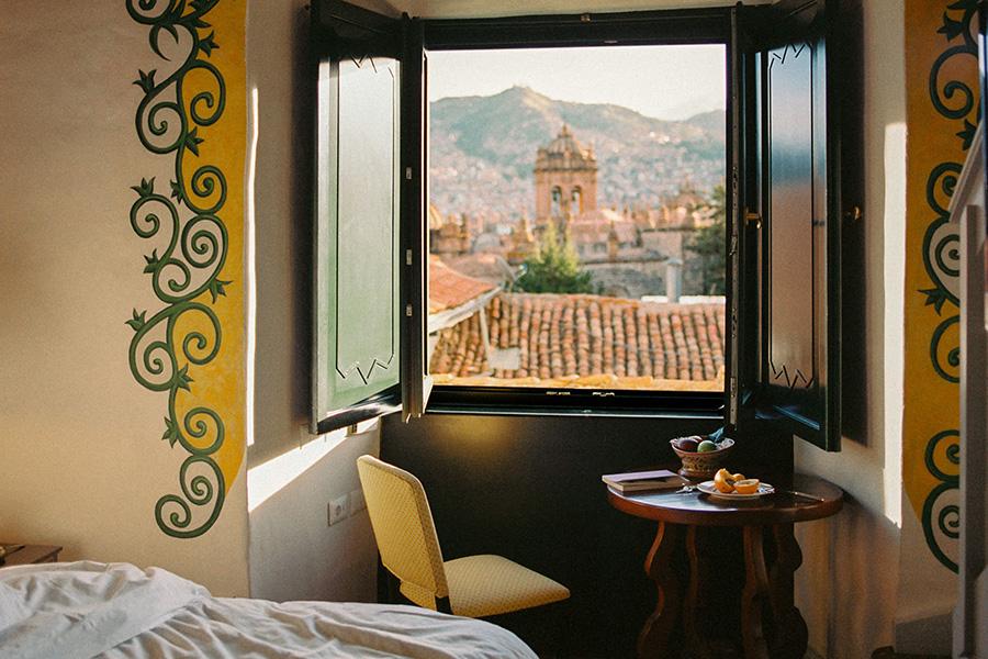 Decompress and admire the view from your elegant suite at Belmond Hotel Monasterio | Photo credit: Belmond