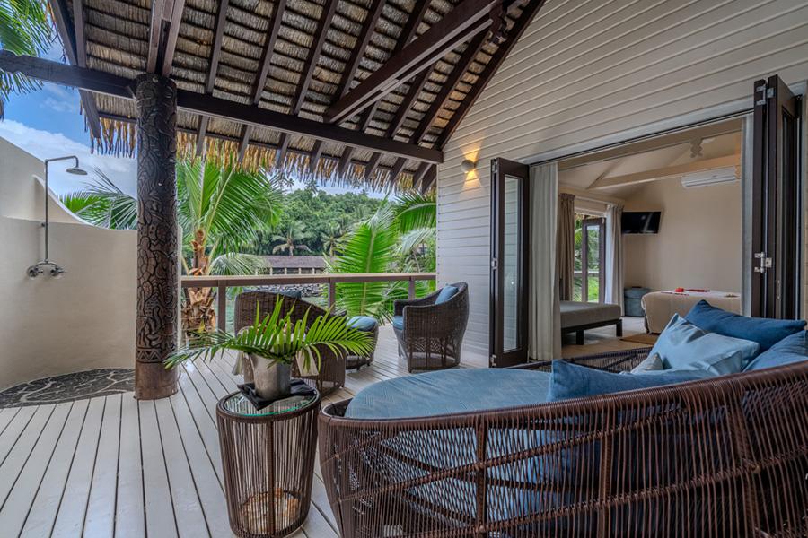 Unwind in style on your villa's beachfront deck at Seabreeze, Samoa | Photo credit: Seabreeze