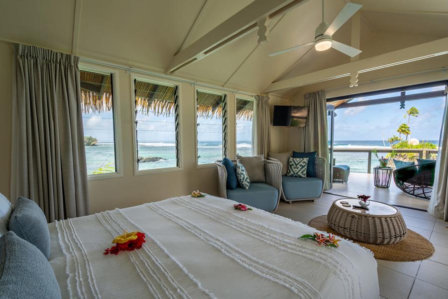 Wind down on your luxury king bed in the honeymoon point villa at Seabreeze, Samoa | Photo credit: Seabreeze