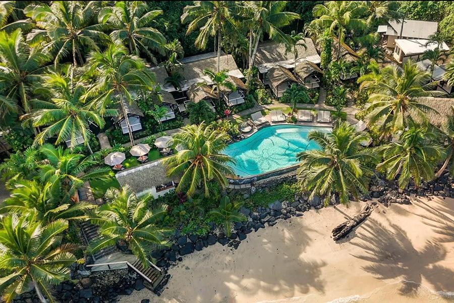 Lounge by the water’s edge at the pool in Seabreeze, Samoa | Photo credit: Seabreeze