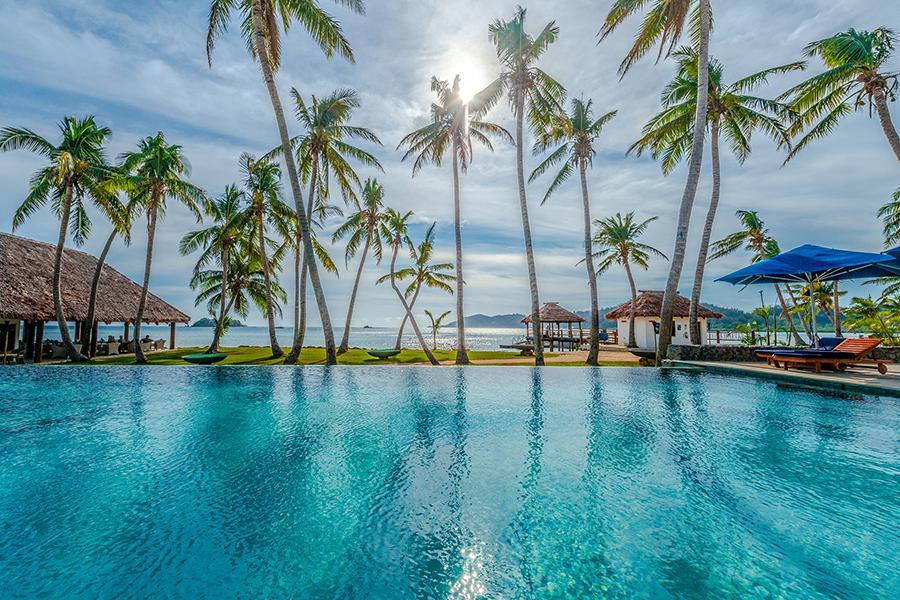 Soak up stunning sea views from this tranquil poolside oasis at Tropica Island Resort | Photo credit: Tropica Island Resort