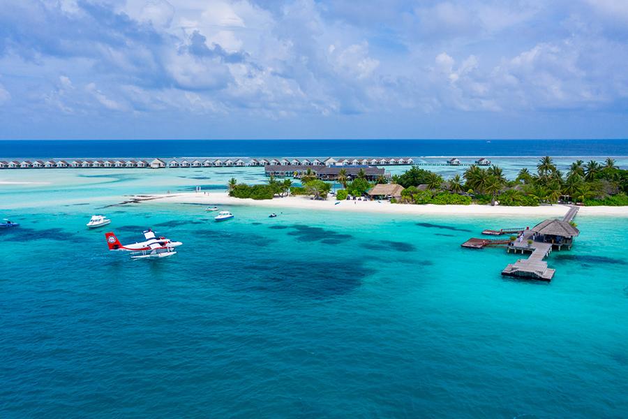 Arrive by seaplane to your luxury tropical resort at LUX South Ari Atol | Photo credit: LUX