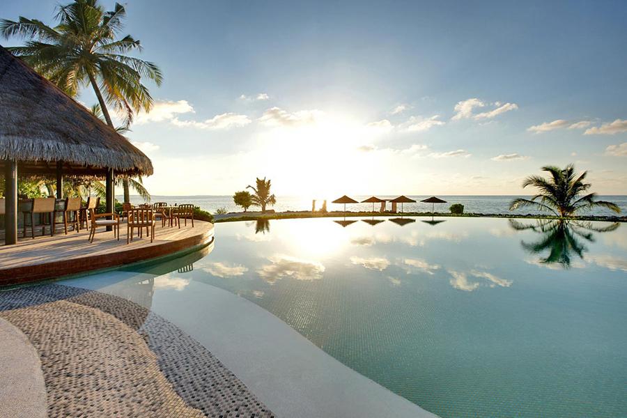 Enjoy a refreshing dip in the pool with shimmering views of the lagoon at LUX South Ari Atol | Photo credit: LUX