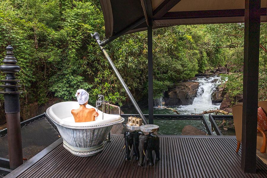 Bathe outdoors with waterfall views from your tent at Shinta Mani Wild, Cambodia | Photo credit: Shinta Mani Wild