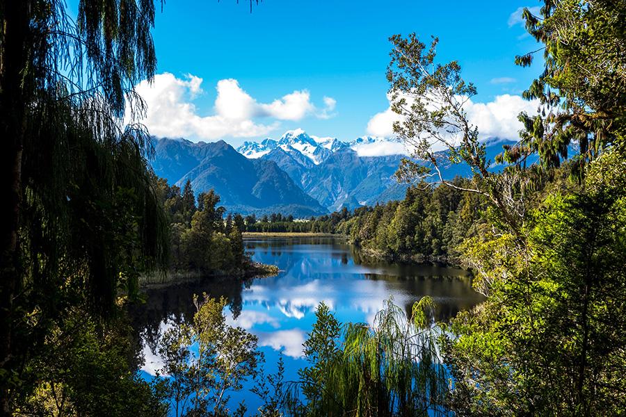 Be captivated by endless alpine vistas across Lake Matheson, New Zealand | Travel Nation