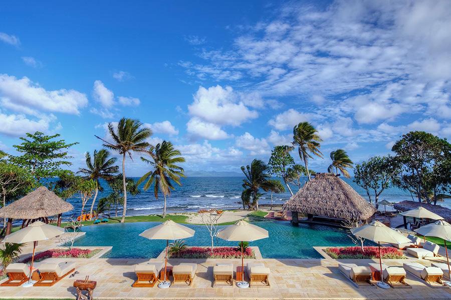 Relax by the pool at Nanuku Island Resort in Fiji | Photo credit: Nanuku Resort