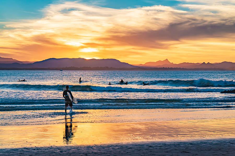 Watch the surfers at sunset in Byron Bay | Travel Nation