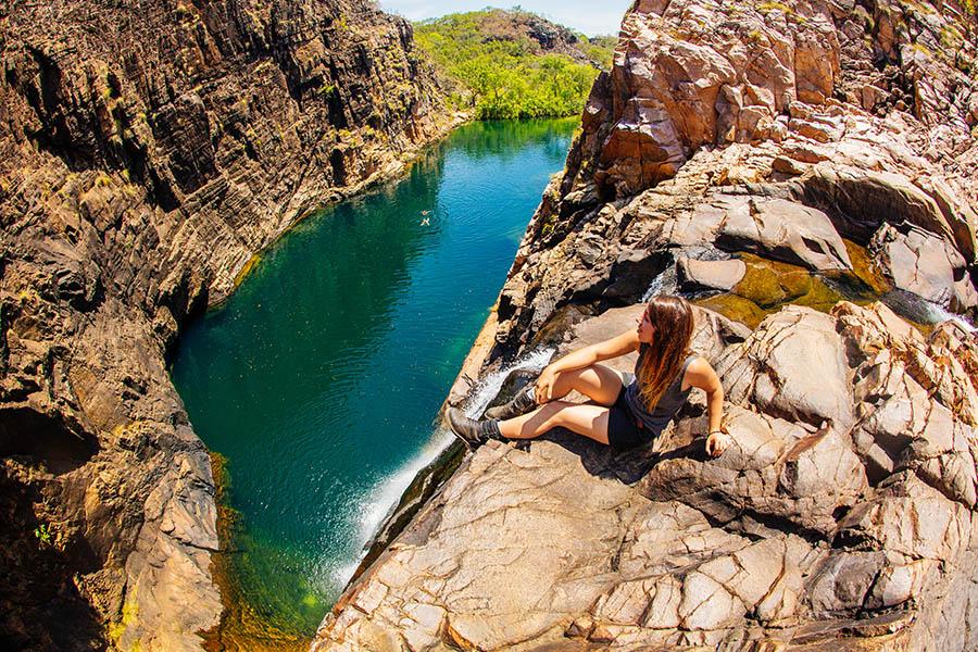 Sitting at Barramundi Gorge, Kakadu National Park, NT | Photo credit Tourism Australia