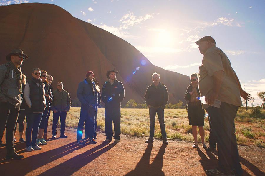Get an overview of this area by taking a guided walk around the base of the rock | Photo credit: Tourism Australia