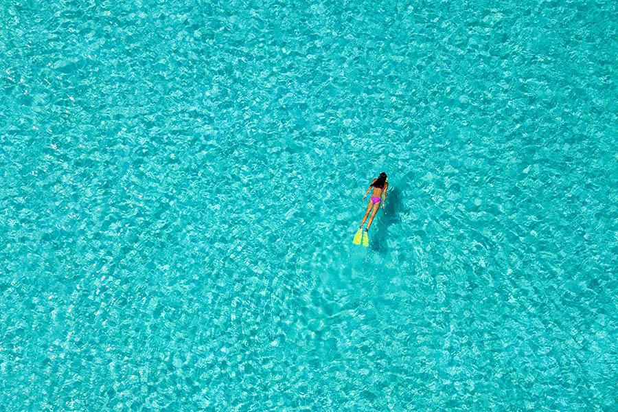 Snorkel through Aitutaki's clear lagoon | Travel Nation