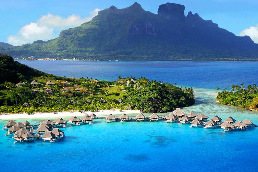 Stay in an overwater bungalow on Moorea | Photo credit: Sofitel La Ora Resort