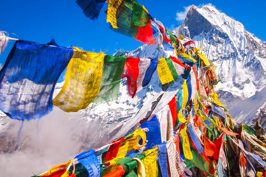 Rainbow prayer flags at Annapurna Base Camp | Travel Nation