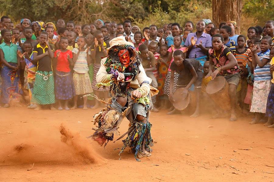Attend a traditional Wamkulu dance ceremony