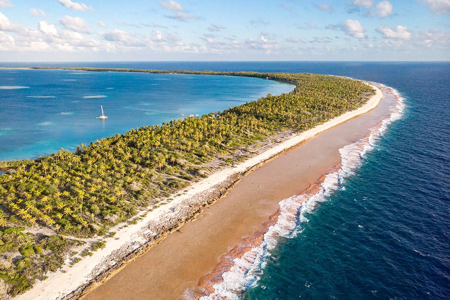 Sip fresh coconuts on the beaches of Ahe | Travel Nation | © Stéphane Mailion Photography