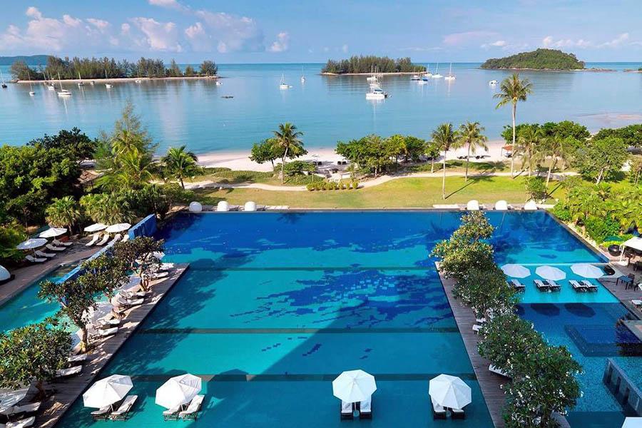 Relax by the pool at your luxury hotel | Photo credit: www.thedanna.com