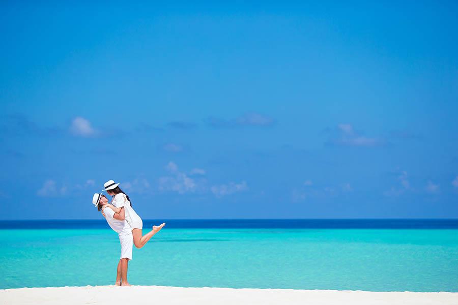 Couple embracing on a Maldives beach