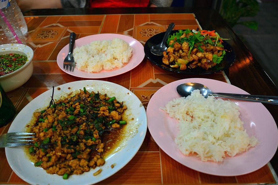 We feasted on plate after plate of garlicky chicken, noodles, spicy pork and banana rice