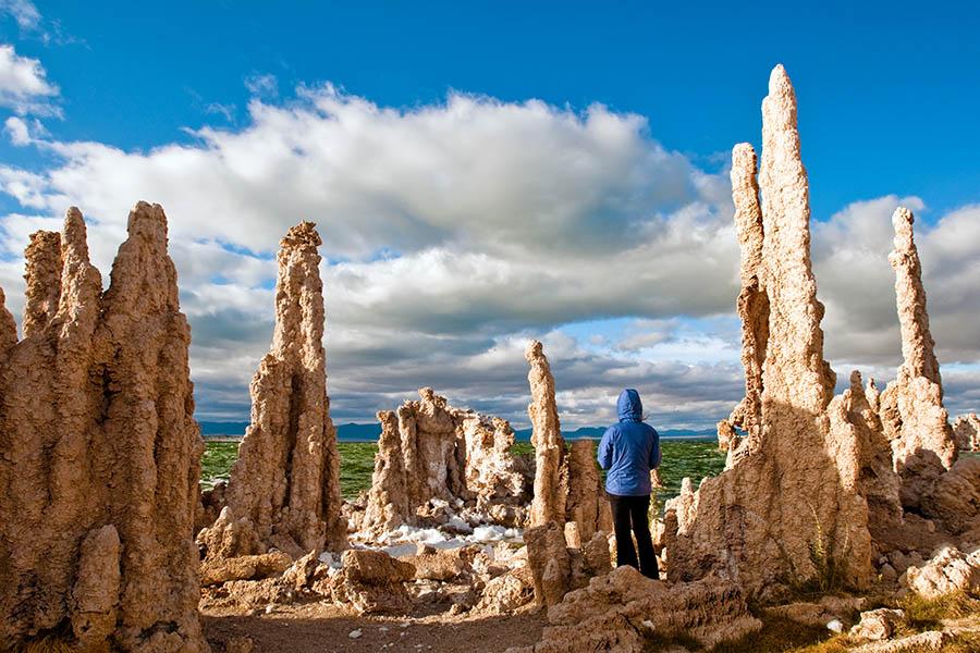 Drive past the bizarre Mono Lake - a soda lake full of strange salt formations