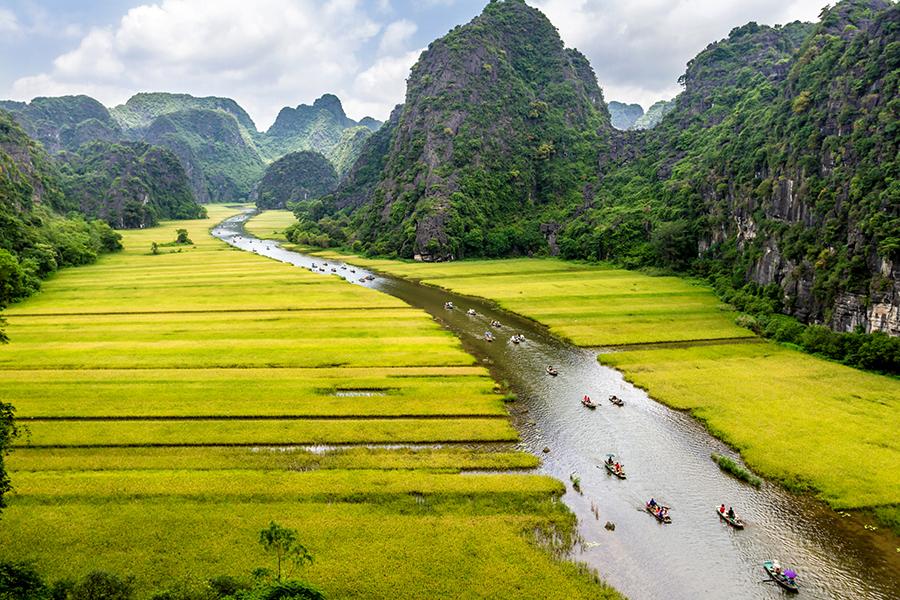 Take a leisurely boat trip through the limestone landscape of Ninh Binh