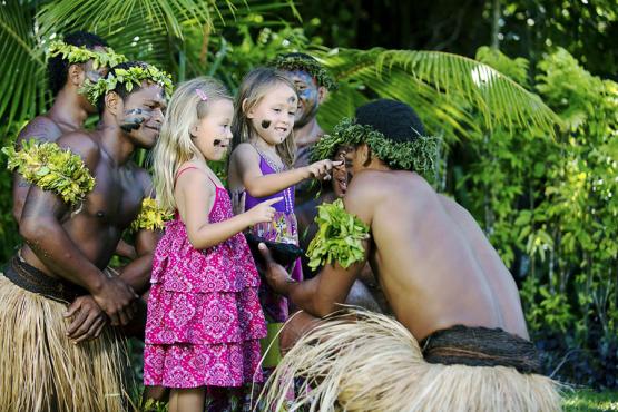Fijian warriors talking to children | Fiji